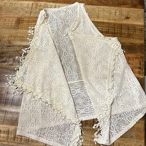 Woman’s crocheted fringe vest cardigan.